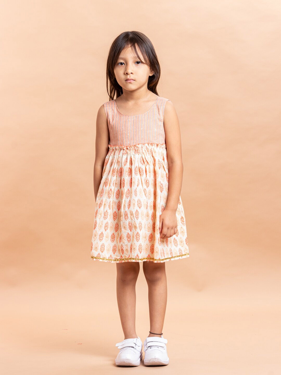 

Sangria Girls Beige & Orange-Coloured Ethnic Motifs Printed Pure Cotton Fit & Flare Dress