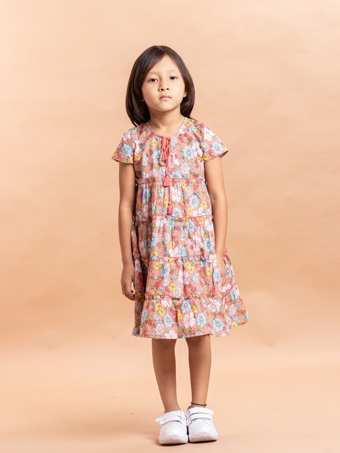 

Sangria Girls Peach-Coloured Floral Printed Tie-Up Neck Pure Cotton Tiered A-line Dress