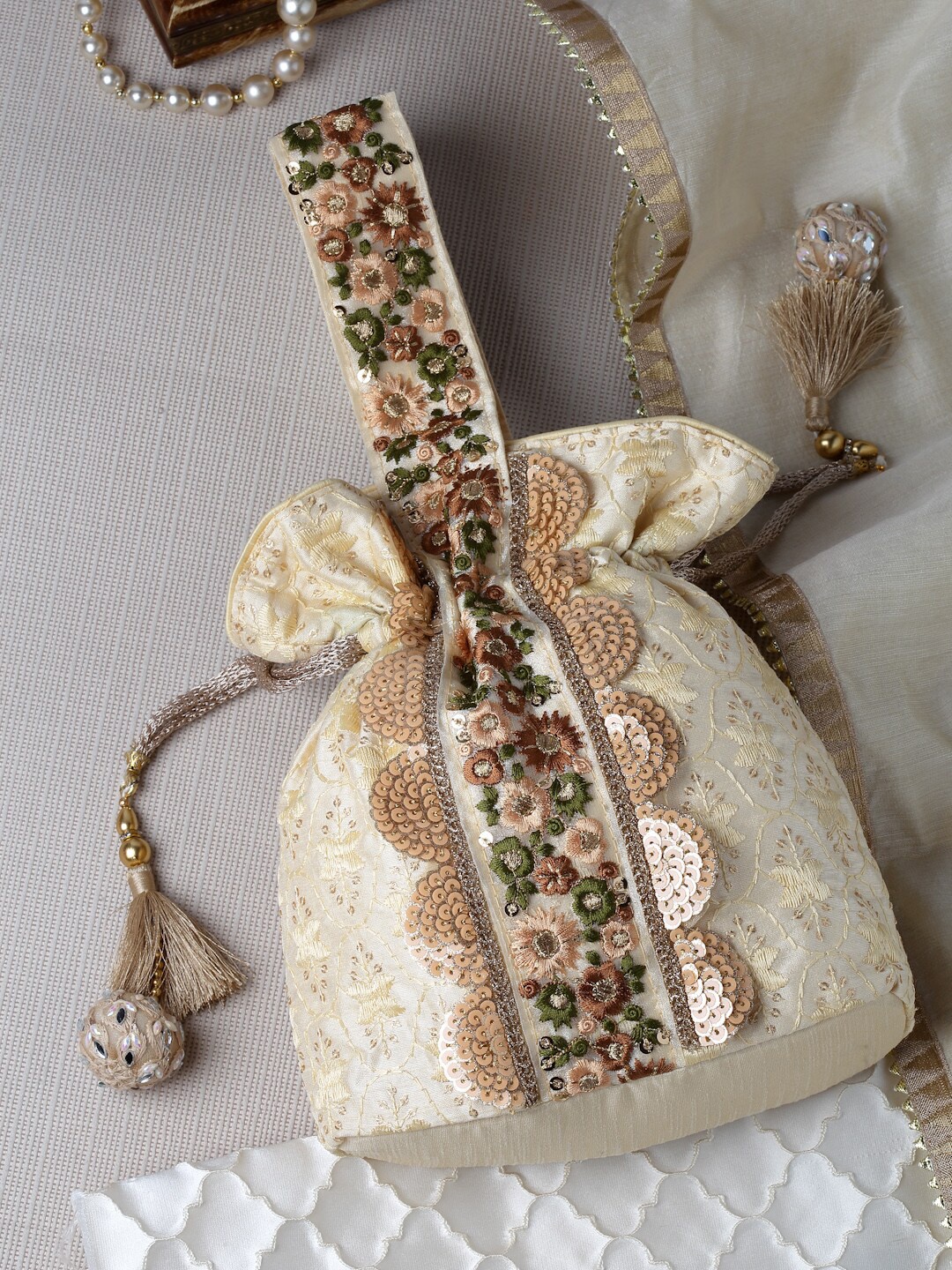 

Anekaant Embellished Tasselled Potli Clutch, Beige