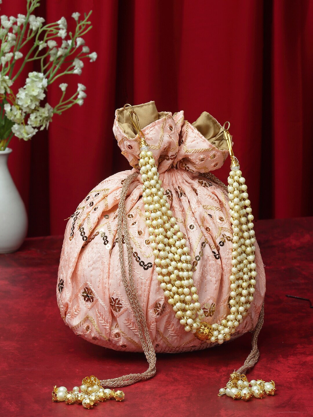 

Anekaant Embroidered Tasselled Potli Clutch, Pink