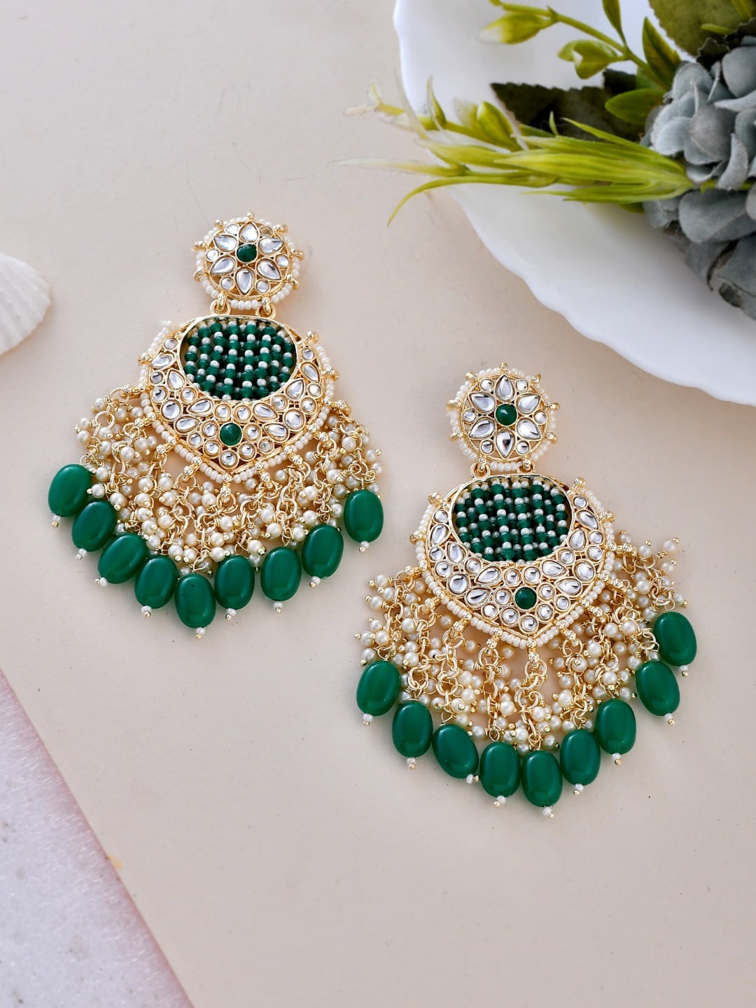 

Ishhaara Brass-Plated Kundan-Studded Feather Shaped Chandbalis, Gold
