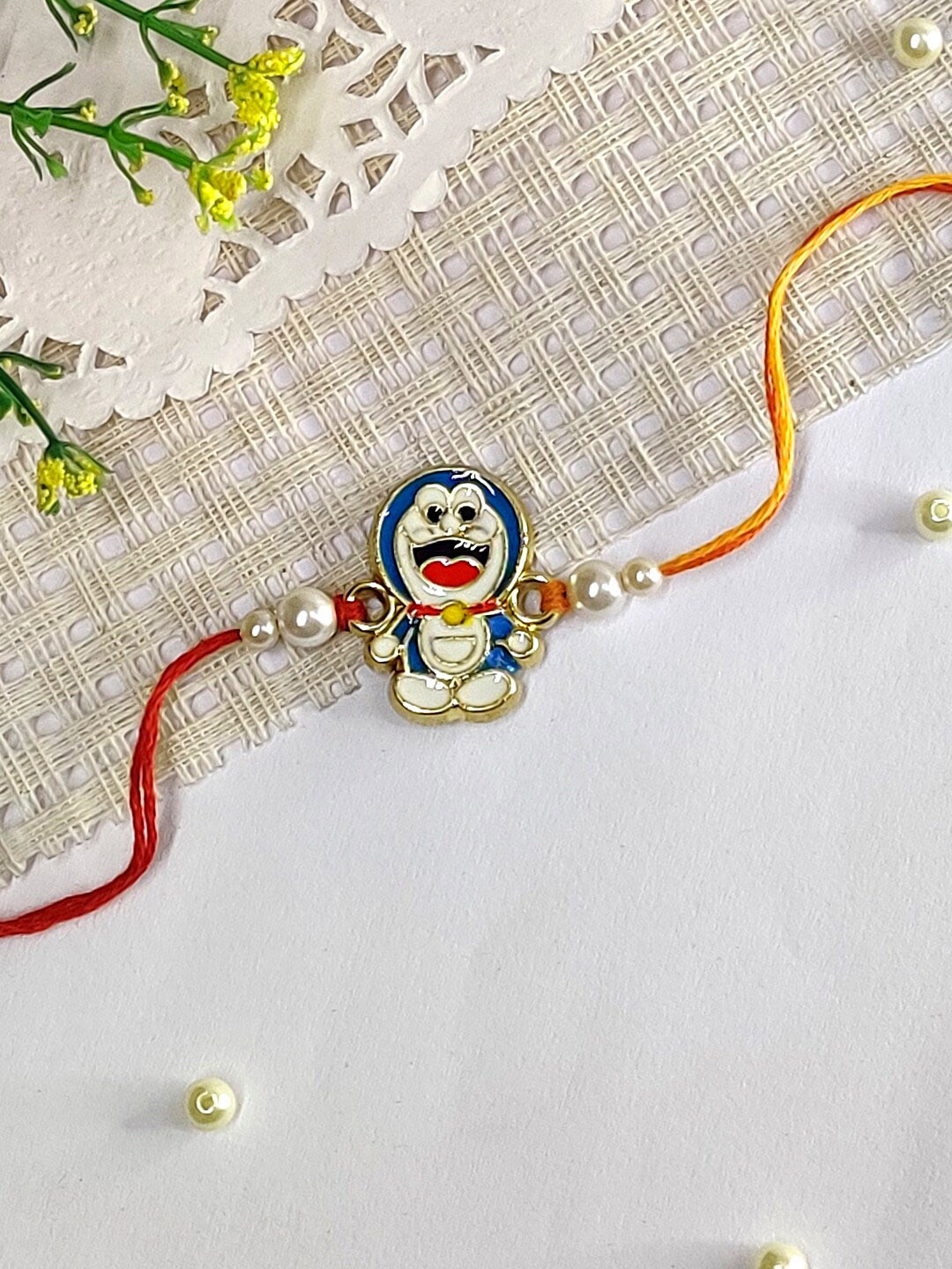 

The Magic Wand Boys Pearl Beaded Doraemon Charm Rakhi, Blue