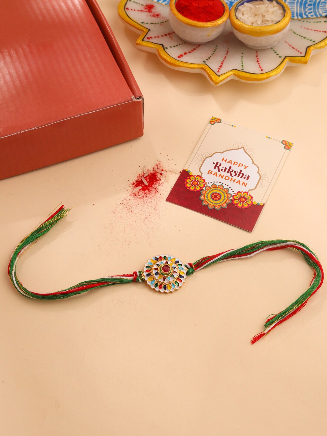 

Natures Buggy Men Ethnic Charm Rakhi With Roli & Chawal, Red