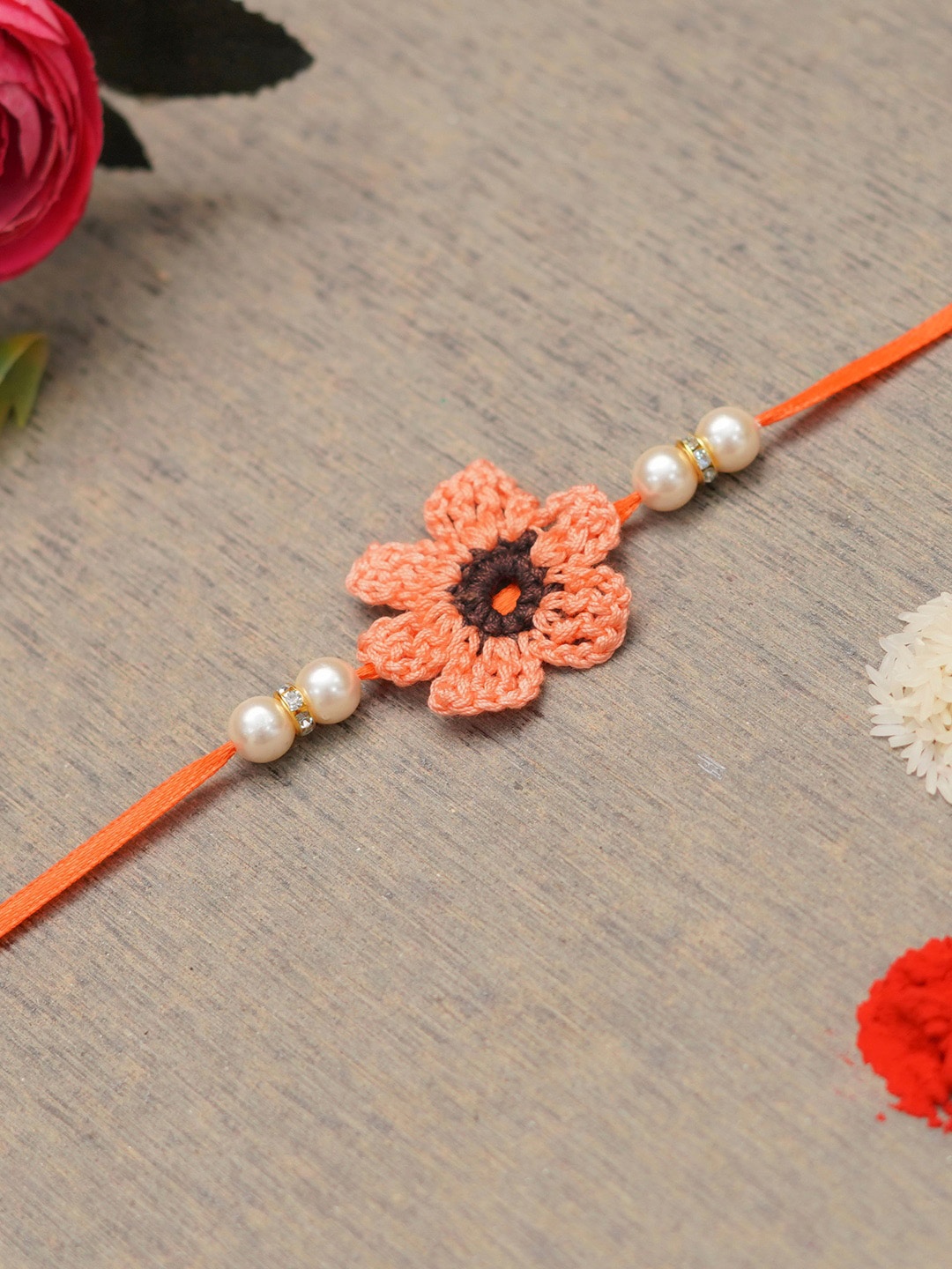 

The Magic Wand Pearl Beaded Crotchet Flower Charm Rakhi, Peach