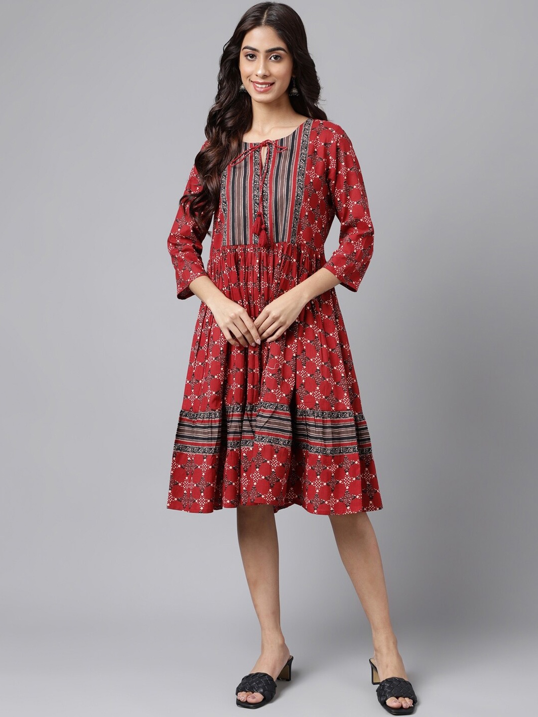 

Janasya Maroon Ethnic Motifs Printed Tie-Up Neck Gathered Fit & Flare Dress