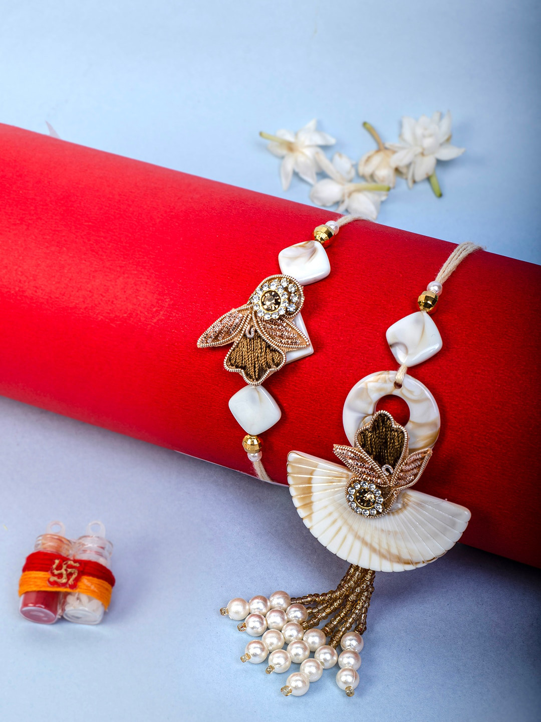 

PANASH Unisex Set Of 2 Stone Studded Charm Rakhis With Roli Chawal, Gold