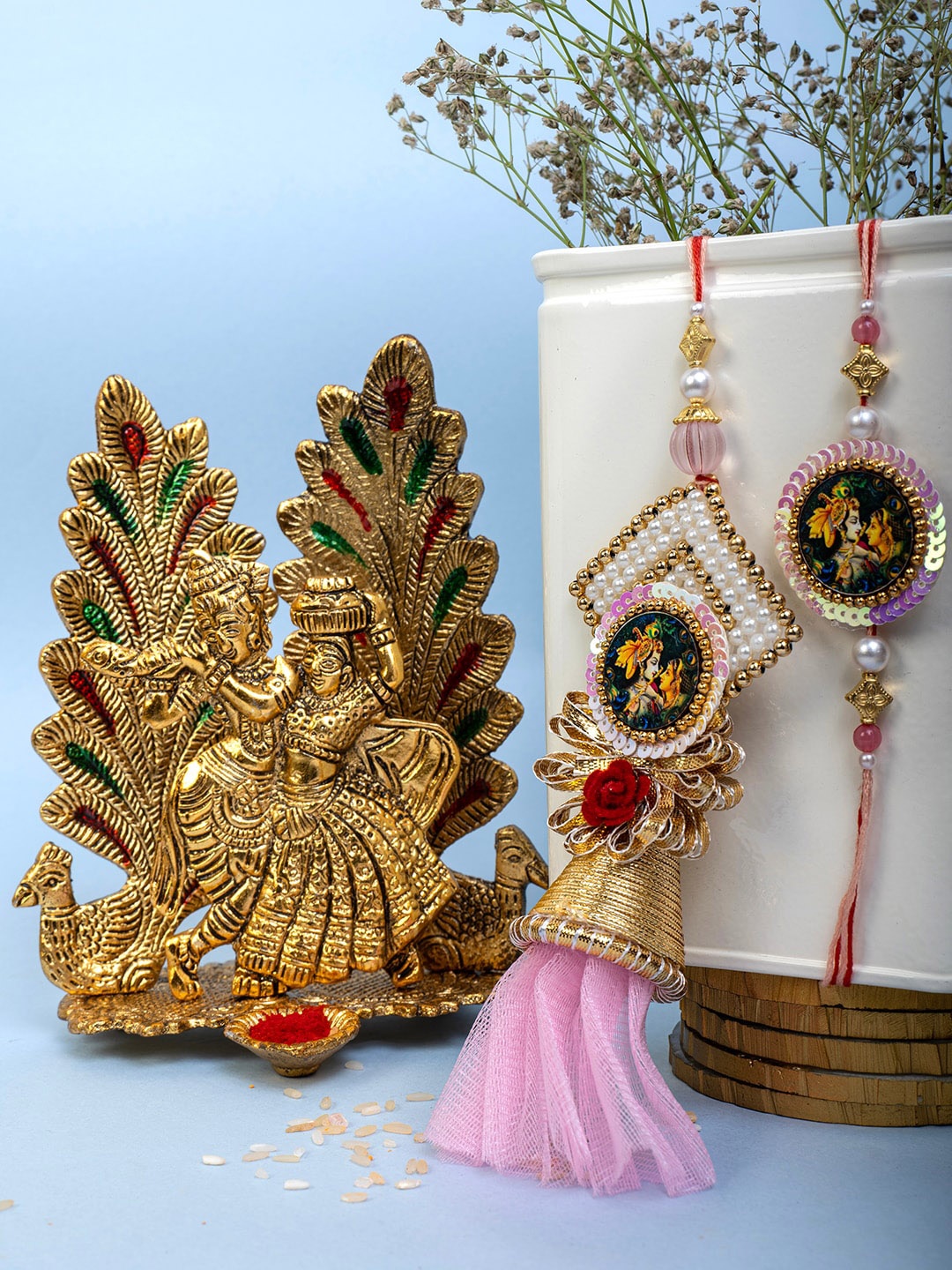 

PANASH Uinsex Set Of 2 Pearls Beaded Charm Rakhis With Radha Krishna & Roli Chawal, Gold