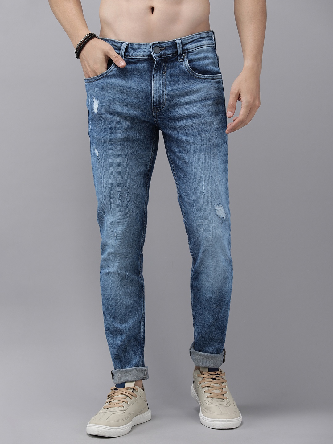 

Roadster Men Tapered Fit Mid-Rise Low Distress Light Fade Jeans, Blue