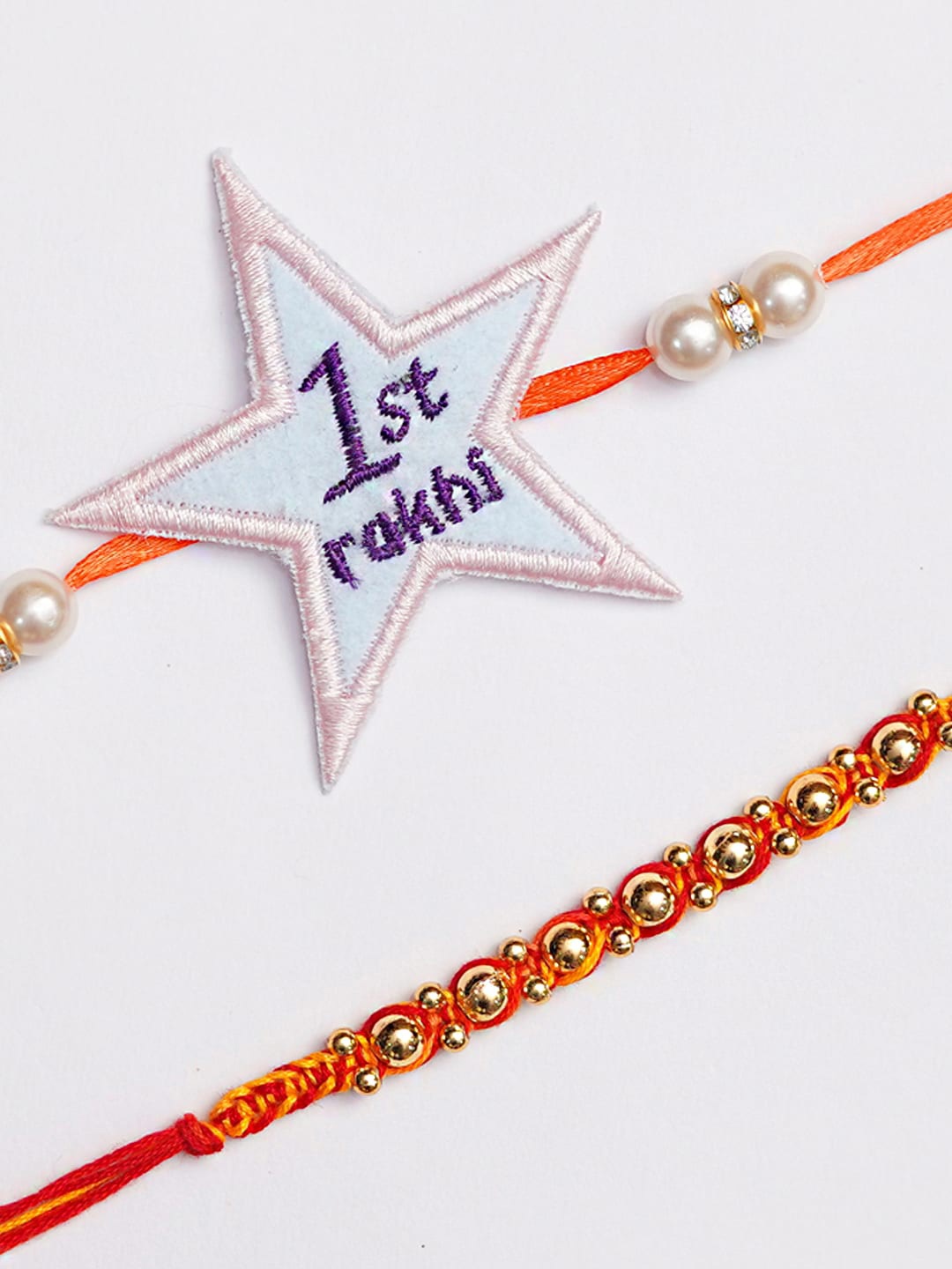 

The Magic Wand Set Of 2 Pearl Beaded Star Charm Rakhi, Red