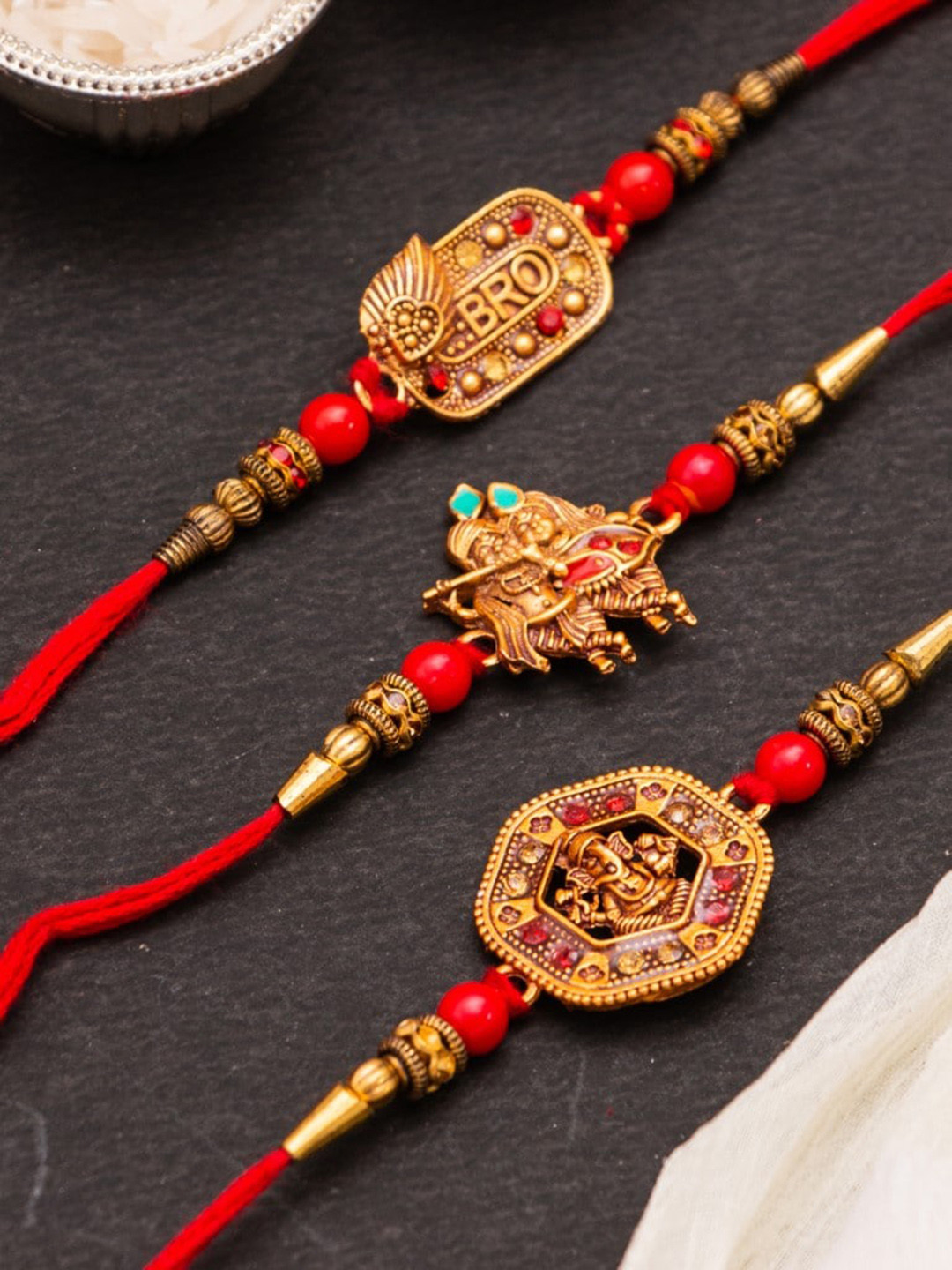 

CraftVatika Unisex Set of 3 Ganesha Rakhi Gift Set, Orange