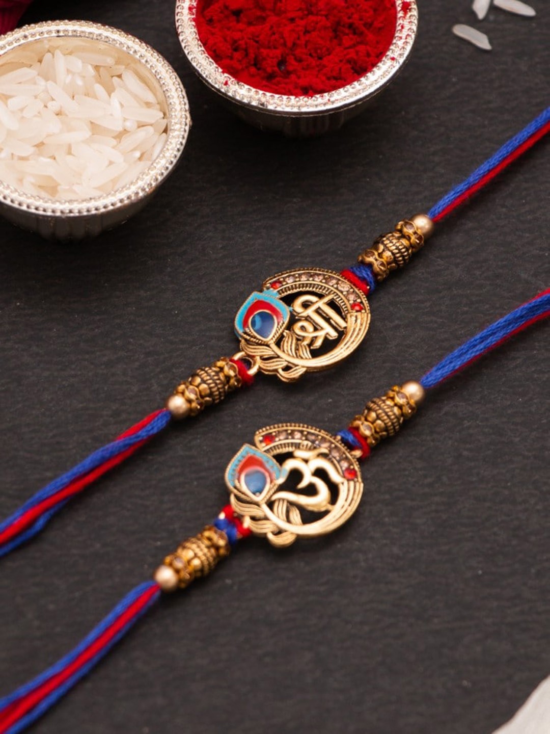 

CraftVatika Unisex Set of 2 OM & Shree Thread Rakhi, Blue