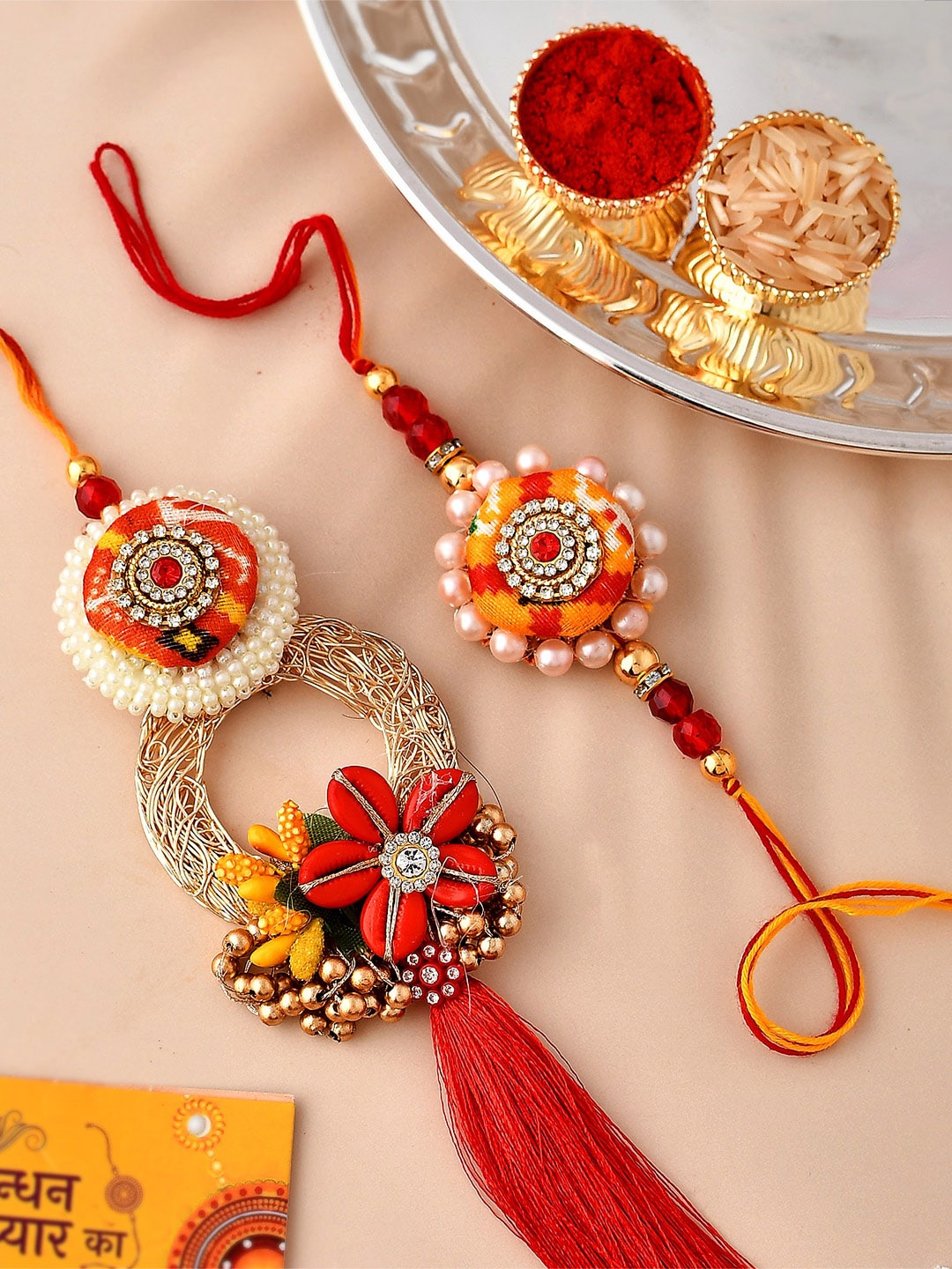 

CraftVatika Unisex Set of 2 Designer Lumba Rakhi Gift Set, Red