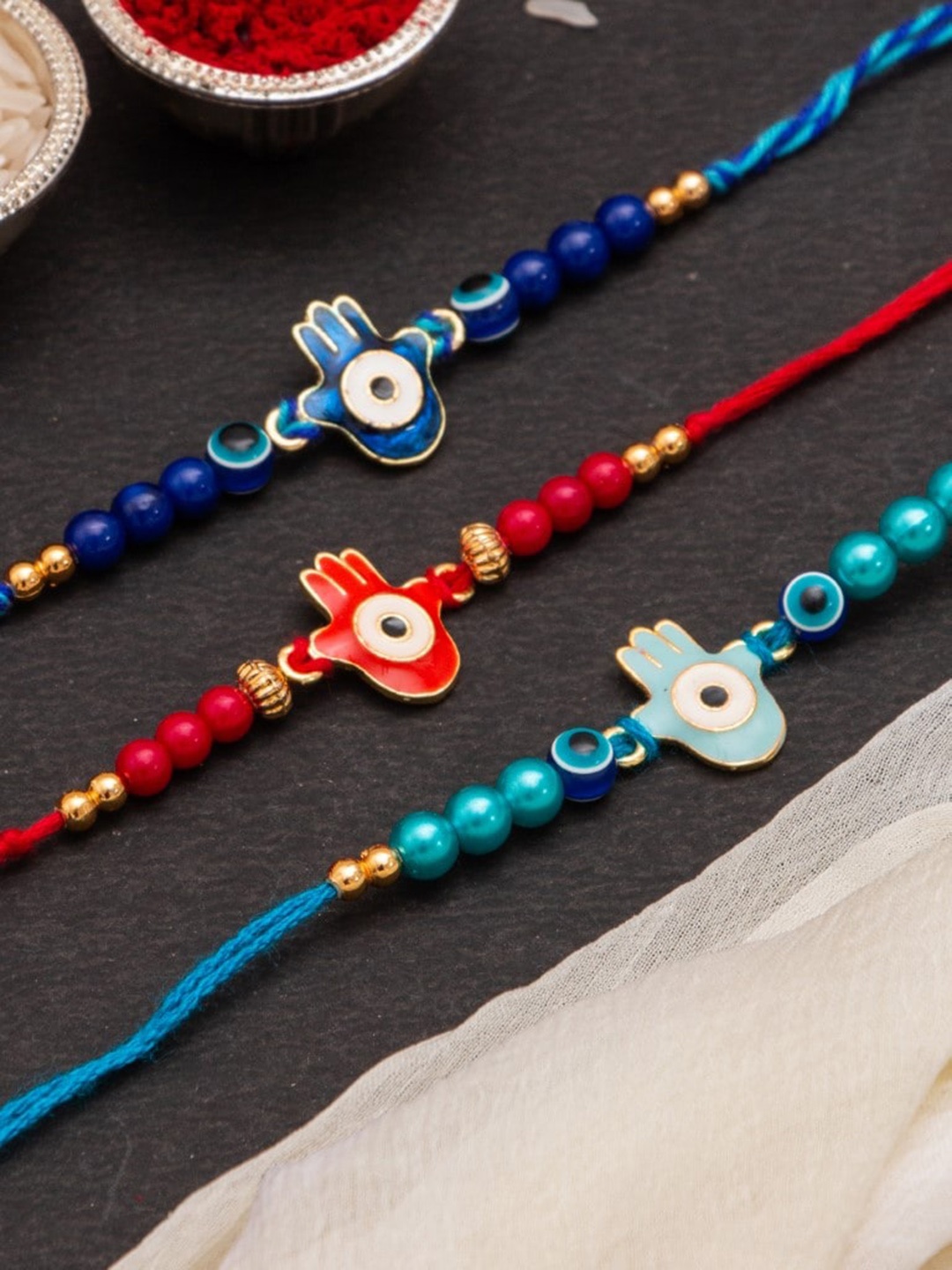 

CraftVatika Unisex Set of 3 Evil Eye Thread Rakhi, Blue