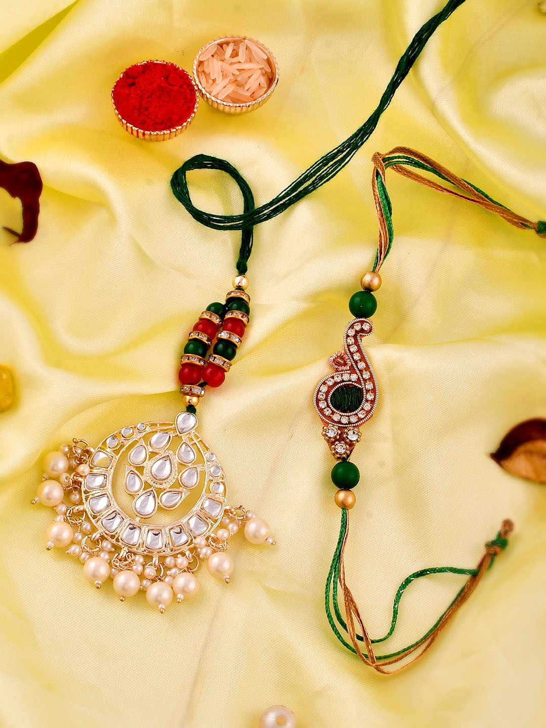 

Shoshaa Set Of 2 Kundan Bhaiya Bhabhi Rakhi lumba Maangtika Gift Set with Roli Chawal, Red