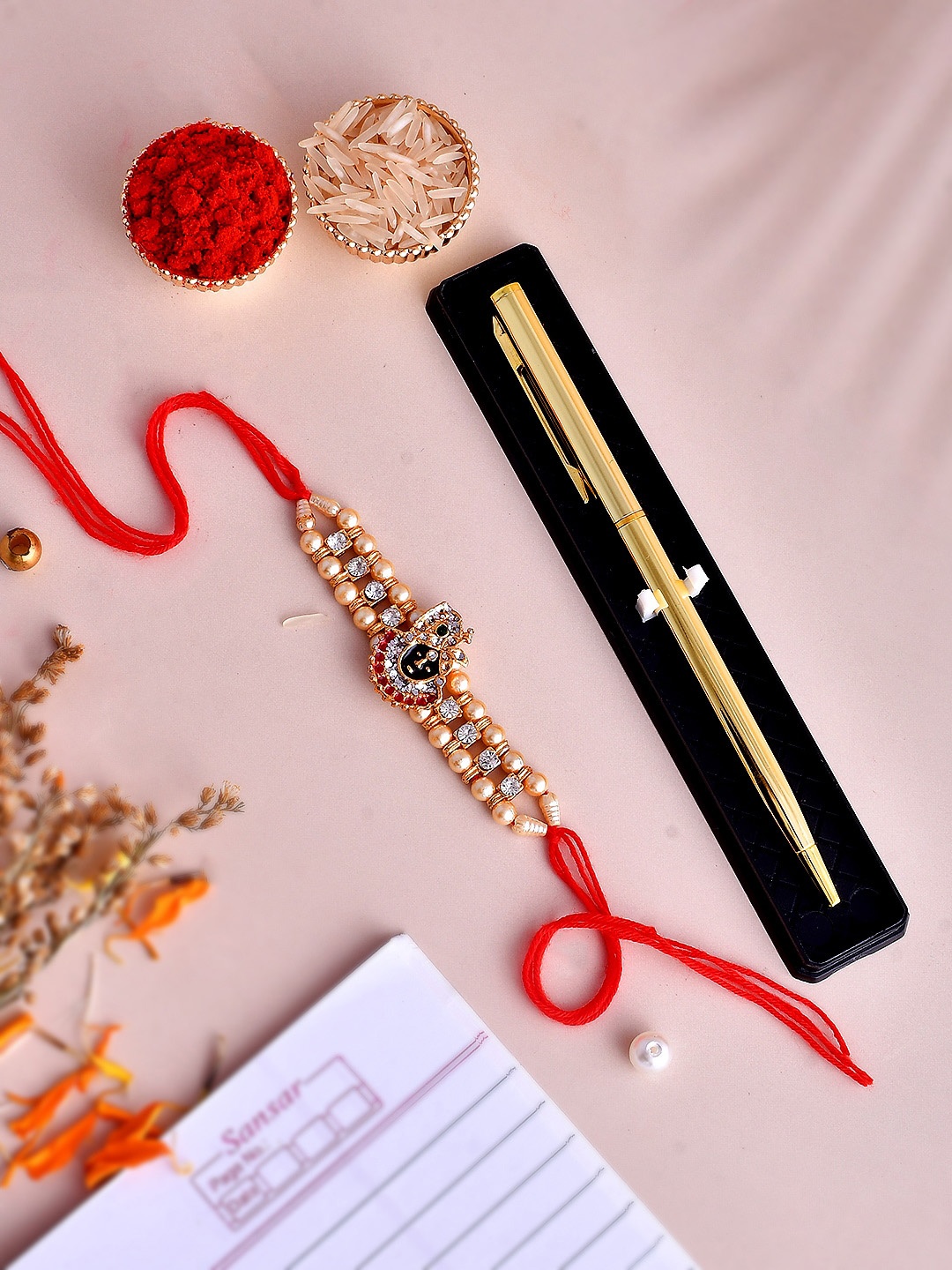 

Shoshaa Men Krishna Bhaiya Rakhi with Pen Gift Set & Roli Chawal, Gold