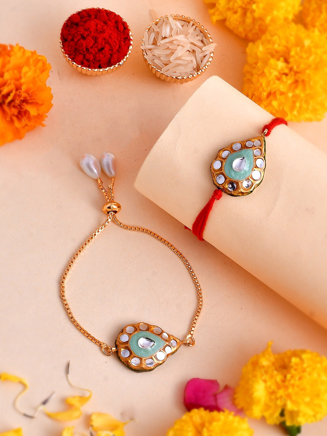 

Shoshaa Set of 2 Kundan Reversible Design Meenakari Bhai Bhabhi Rakhi Set, Red