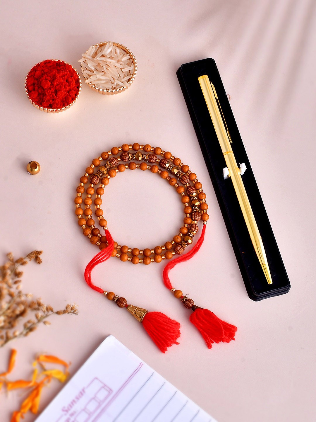 

Shoshaa Rudraksh Men Beaded Bhaiya Rakhi with Pen & Roli Chawal Gift Set, Brown