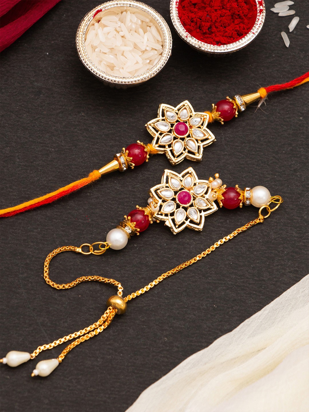 

CraftVatika Set Of 2 Kundan Floral Rakhi With Roli & RIce, Red