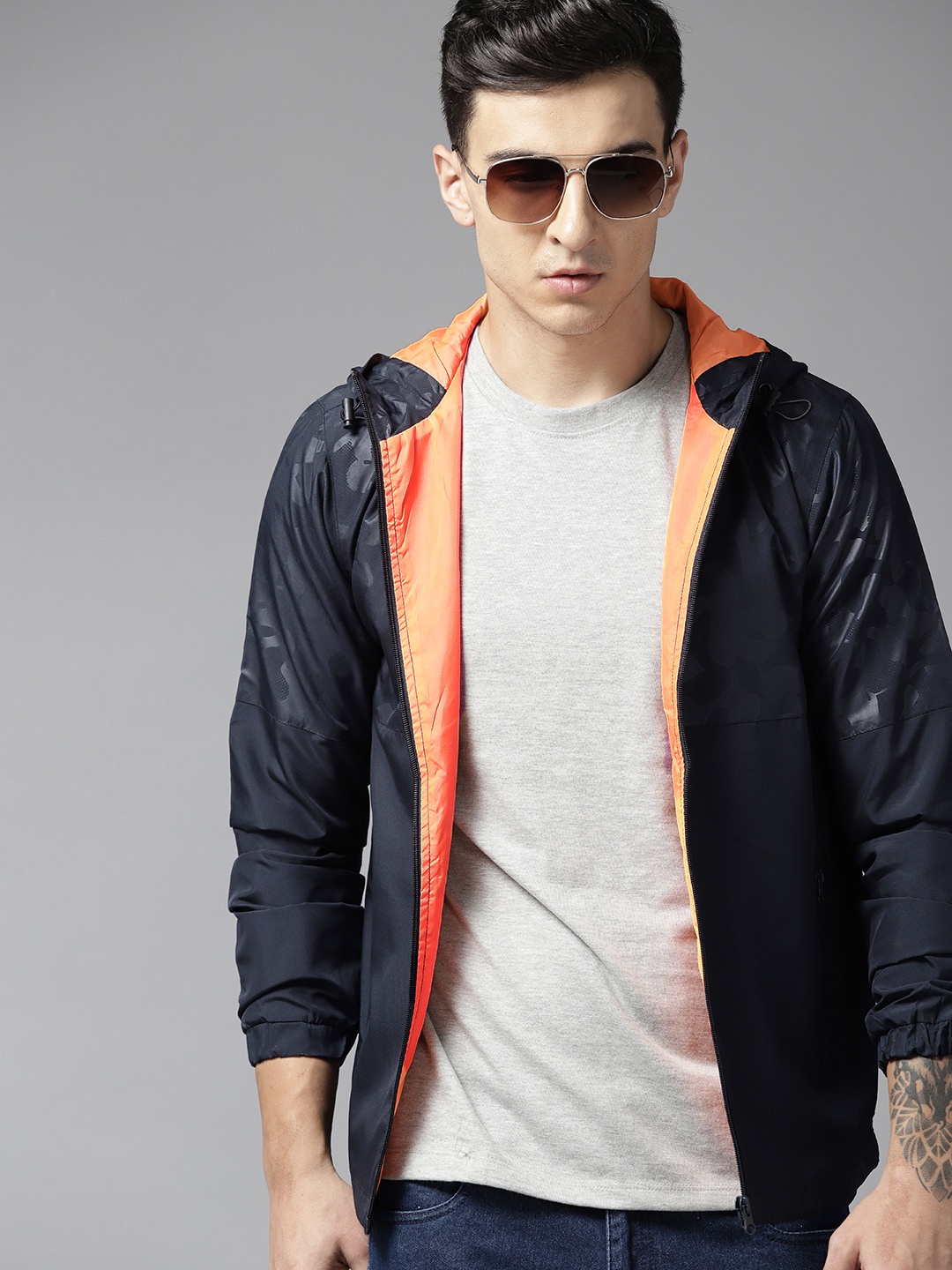 

Roadster Men Abstract Printed Slim Fit Light Weight Rapid-Dry Windcheater, Navy blue