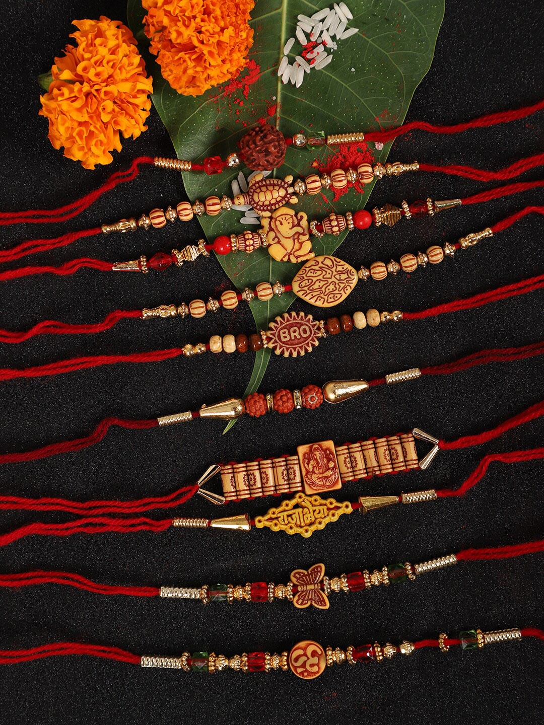 

Anouk Red Set Of 10 Ganesha & Om Charm Rakhi