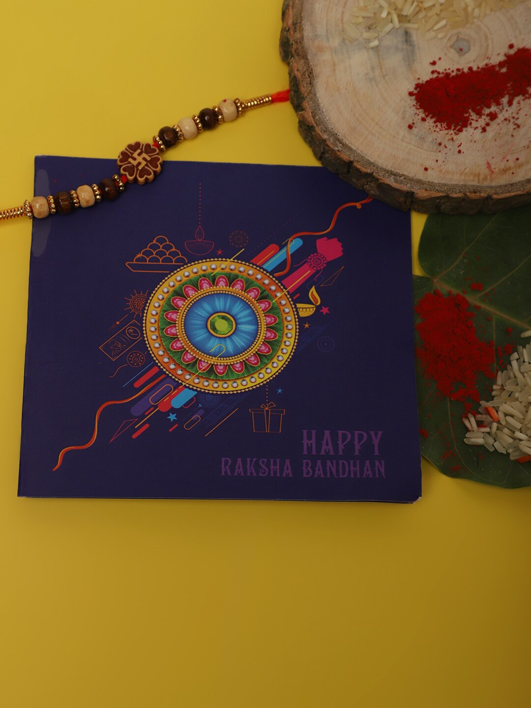 

Anouk Unisex Red Swastik Charm & Beaded Rakhi With Roli Chawal & Greetings Card