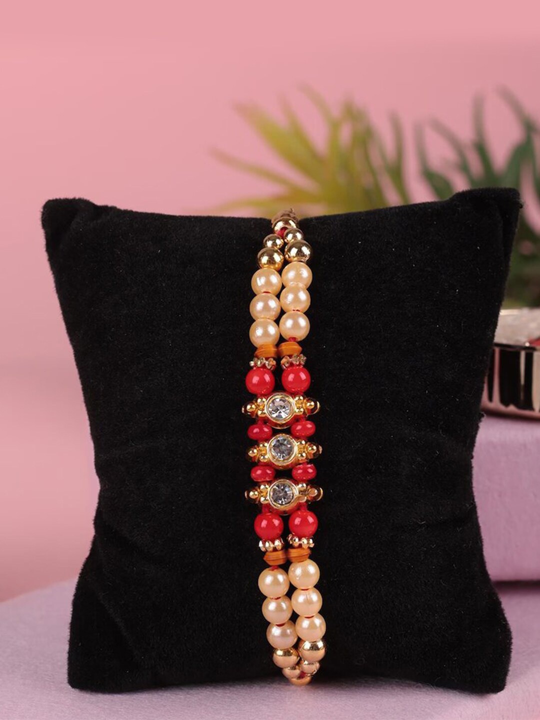 

Aromatic Fables Beaded Rakhi With Cupcake Scented Candle, White