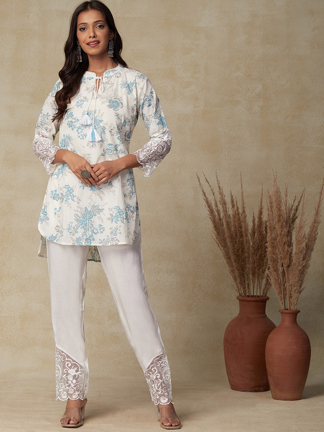 

FASHOR White Floral Printed Tie Up Neck Thread Work Pure Cotton Kurti with Trousers