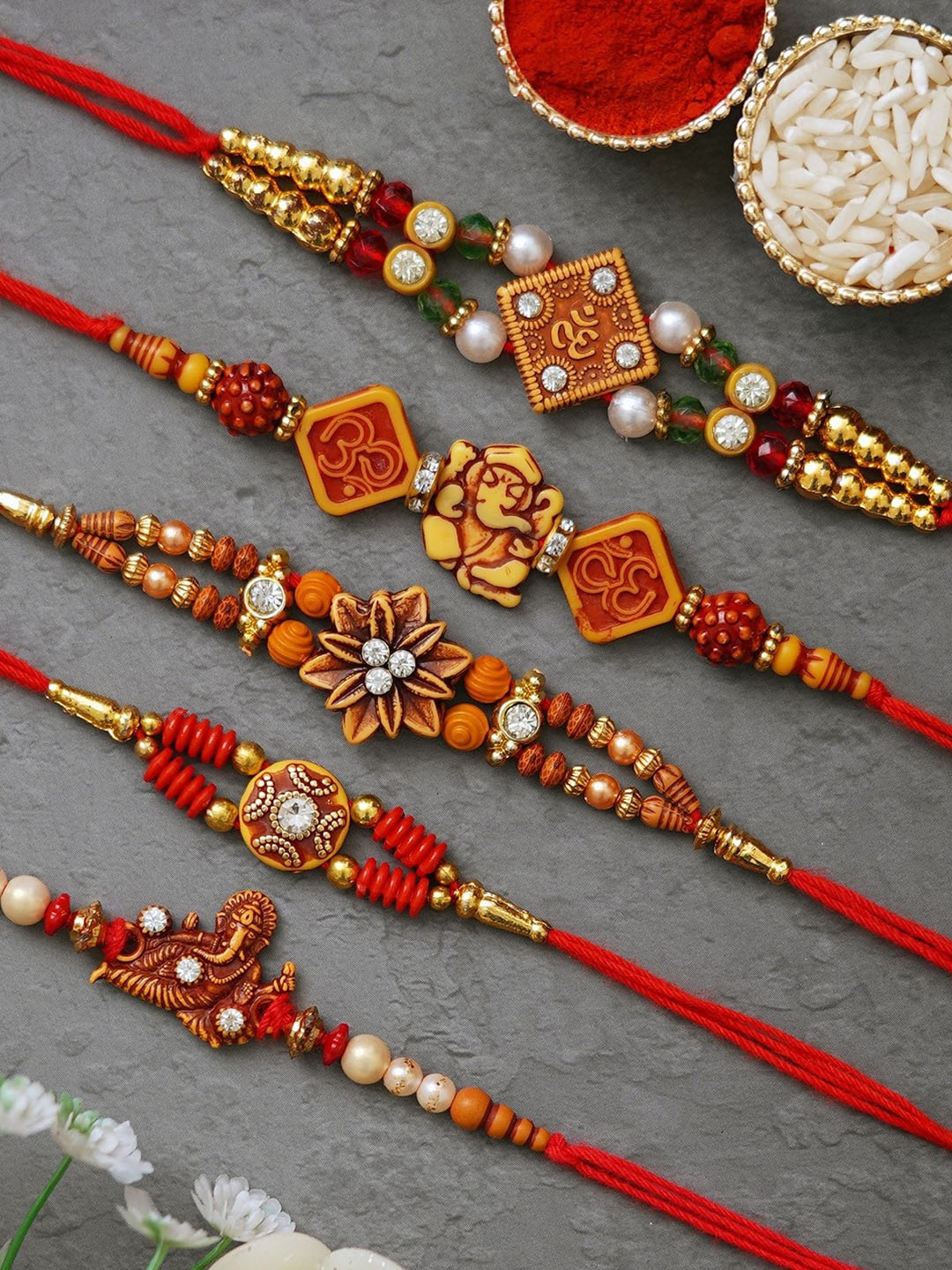 

Fashion Bizz Set of 5 Studded Thread Rakhi With Akshat Kumkum, Red