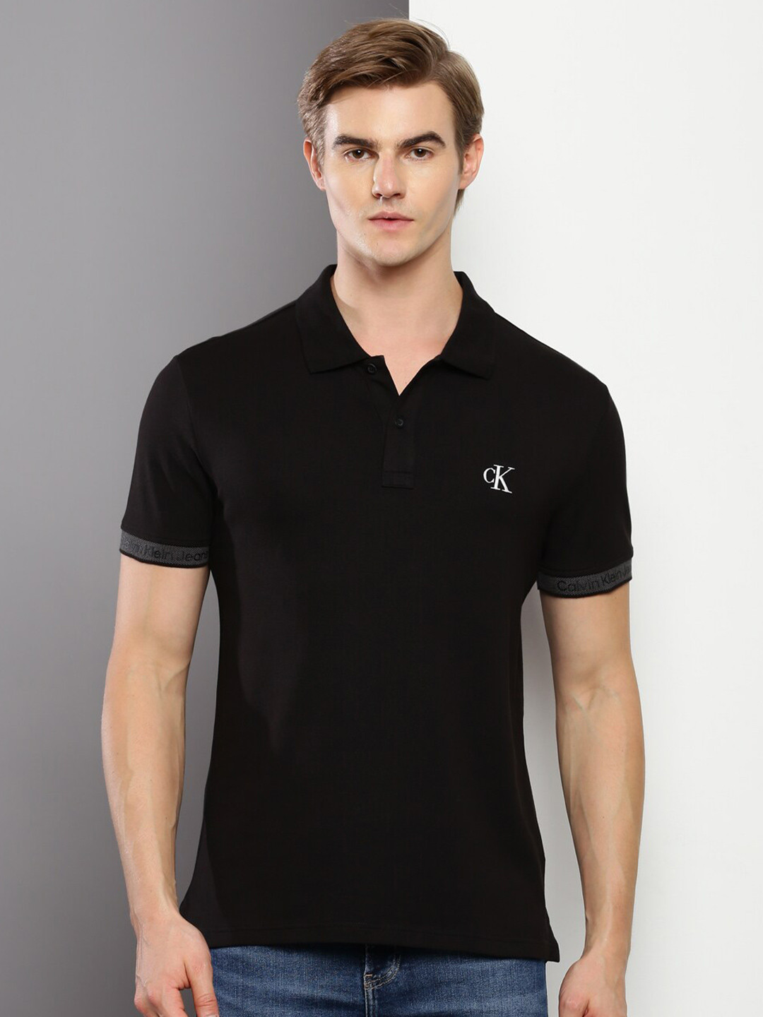

Calvin Klein Jeans Men Solid Polo Collar T-shirt, Black