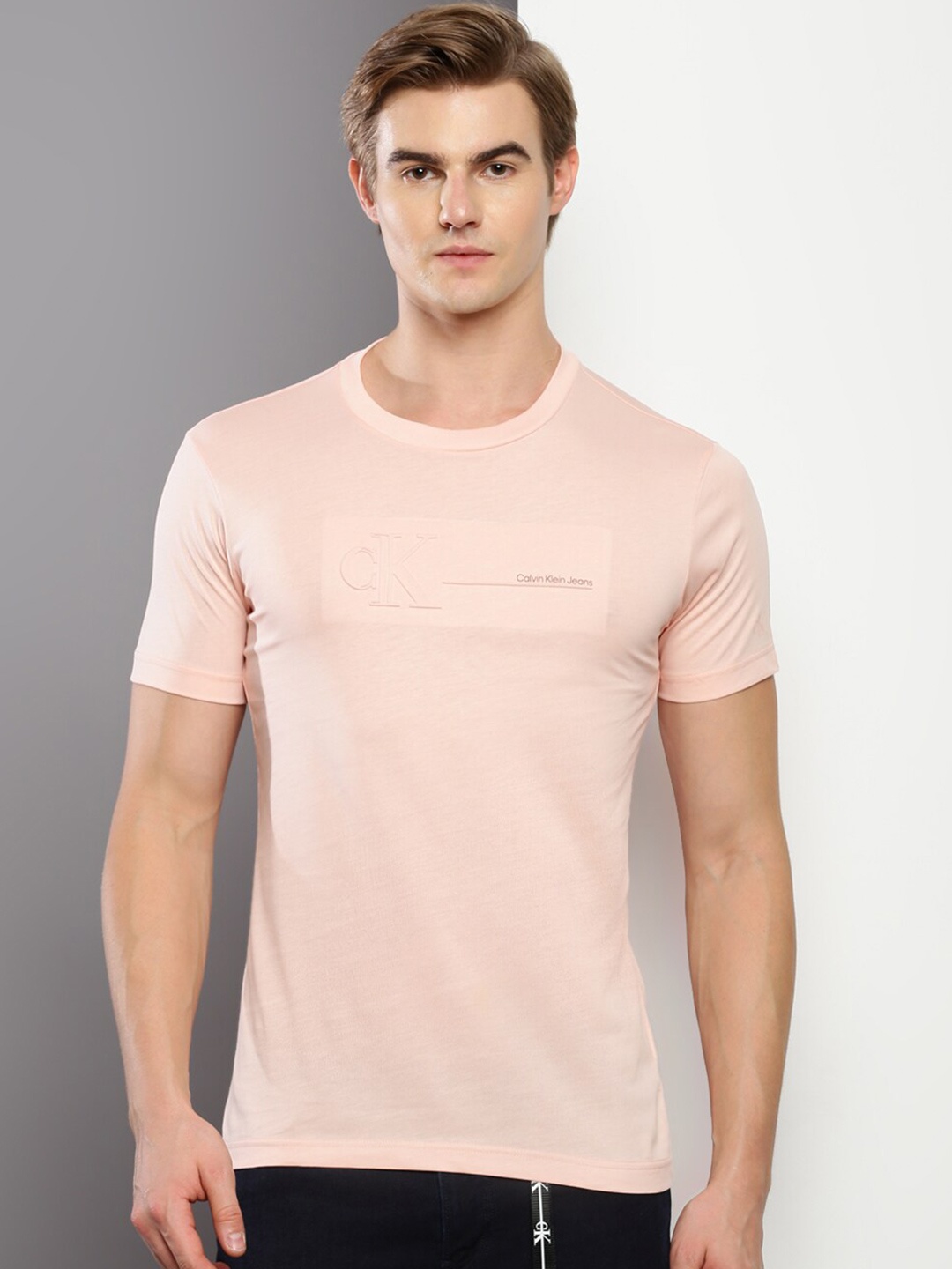 

Calvin Klein Jeans Men Solid Slim Fit T-shirt, Pink