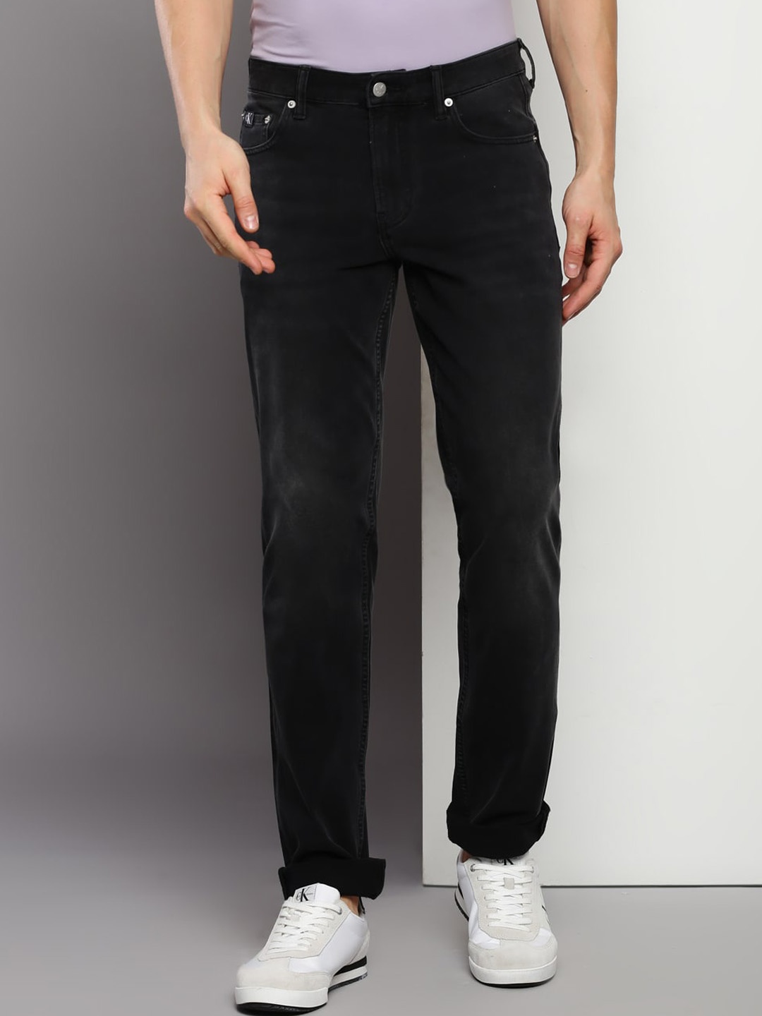 

Calvin Klein Jeans Men Slim Fit Mid Rise Clean Look Cotton Jeans, Black