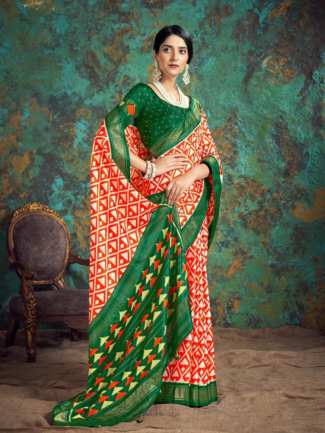 

Mitera Orange & Green Geometric Printed Silk Blend Patola Saree