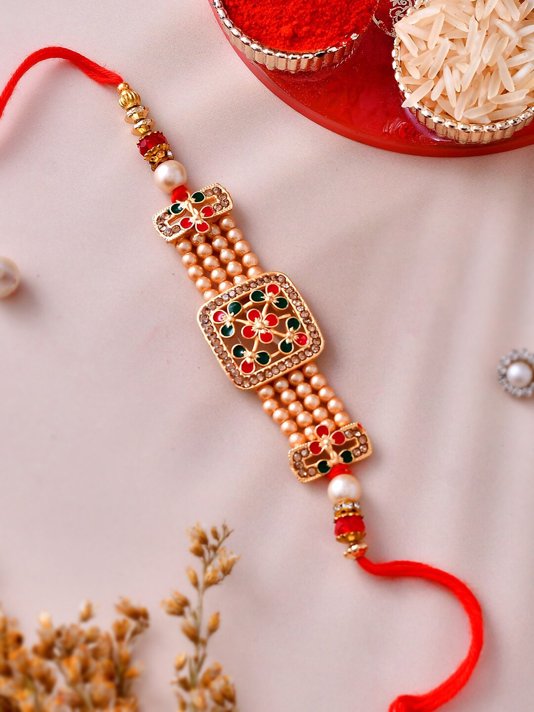 

Aapno Rajasthan Unisex Set Of 4 Kundan & Rose Gold Pearl Crafted Bhaiya Rakhi Gift Set, Red