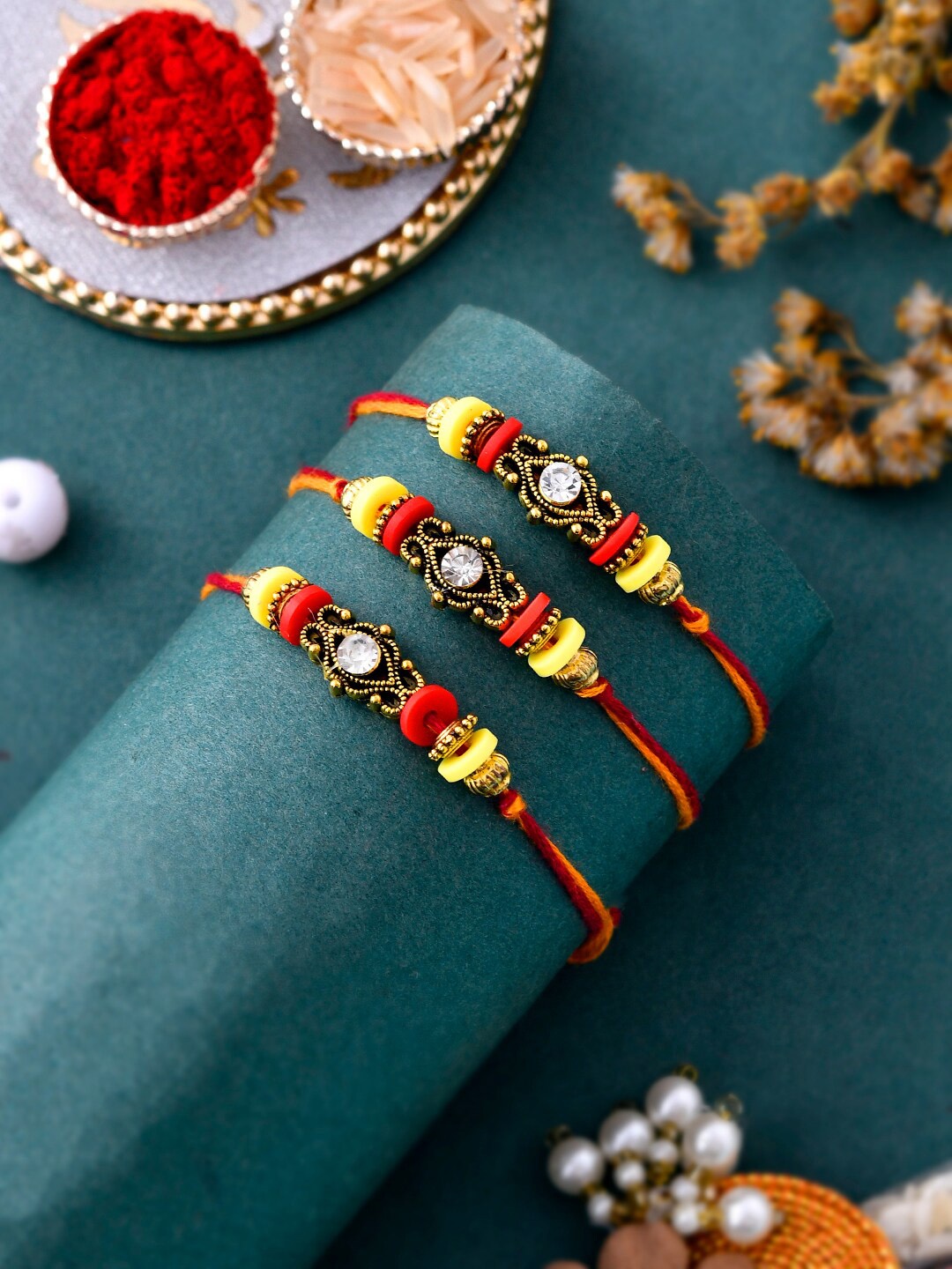 

Aapno Rajasthan Set Of 3 Stud Beaded Thread Rakhi, Red