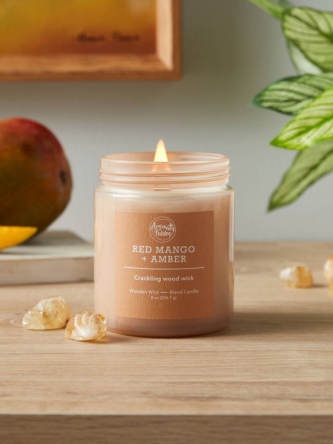 

Aromatic Fables Orange-Colored Amber Scented Round Glass Jar Candle