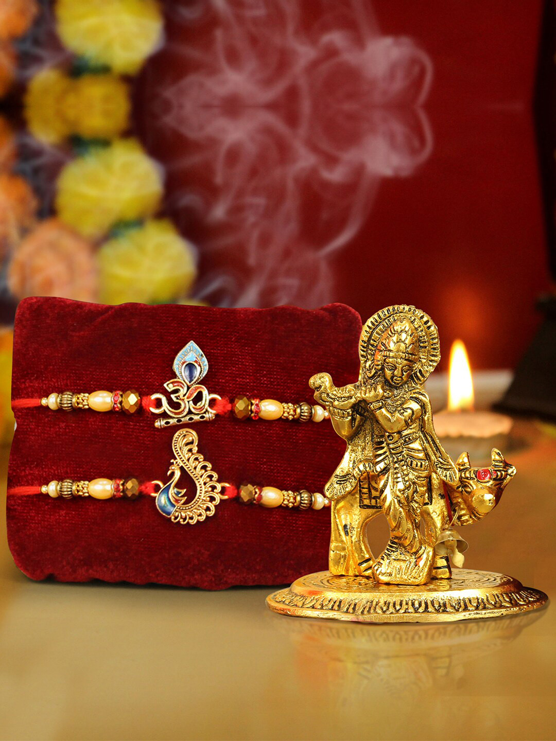

TIED RIBBONS Unisex Set Of 2 Charm Rakhi With Roli Rice & Greeting Card & Idol Gift Set, Gold