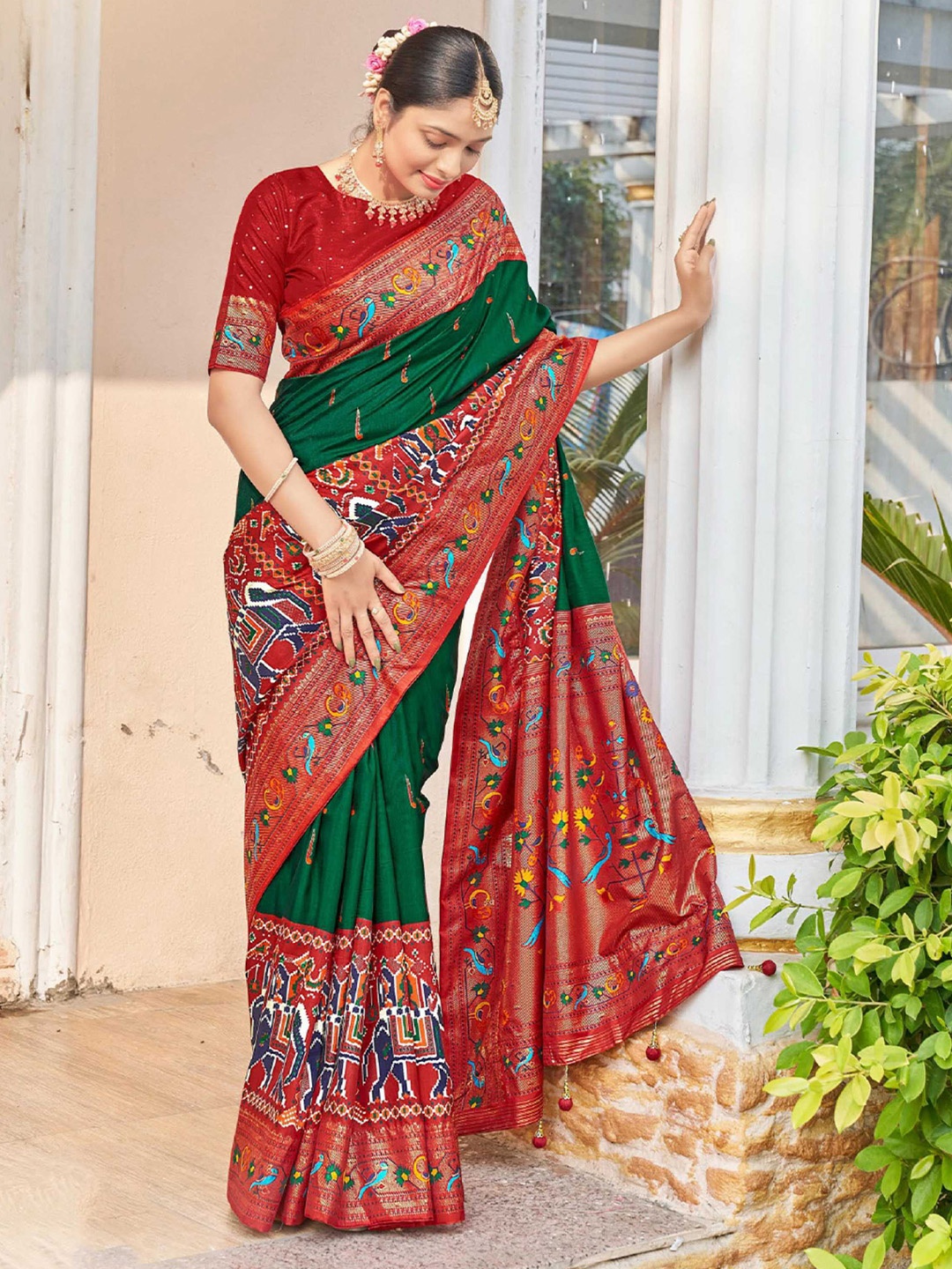 

Mitera Green & Red Ethnic Motifs Printed Zari Patola Saree