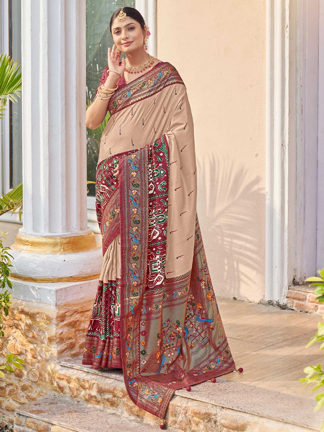 

Mitera Beige & Maroon Ethnic Motifs Printed Zari Patola Saree