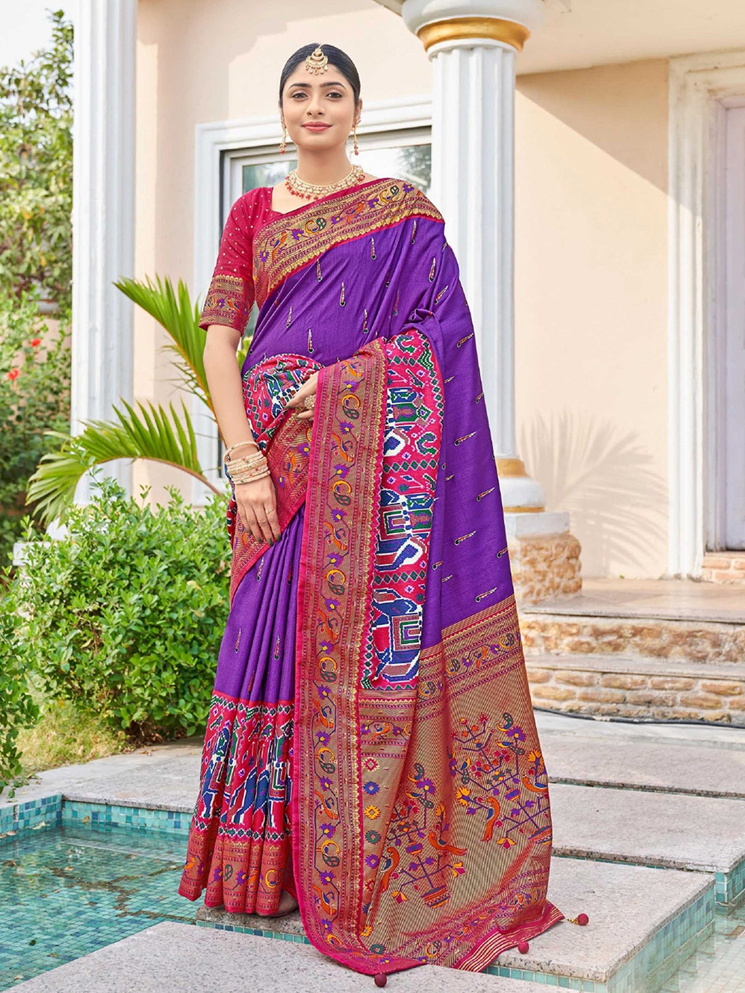 

Mitera Purple & Red Ethnic Motifs Printed Zari Patola Saree