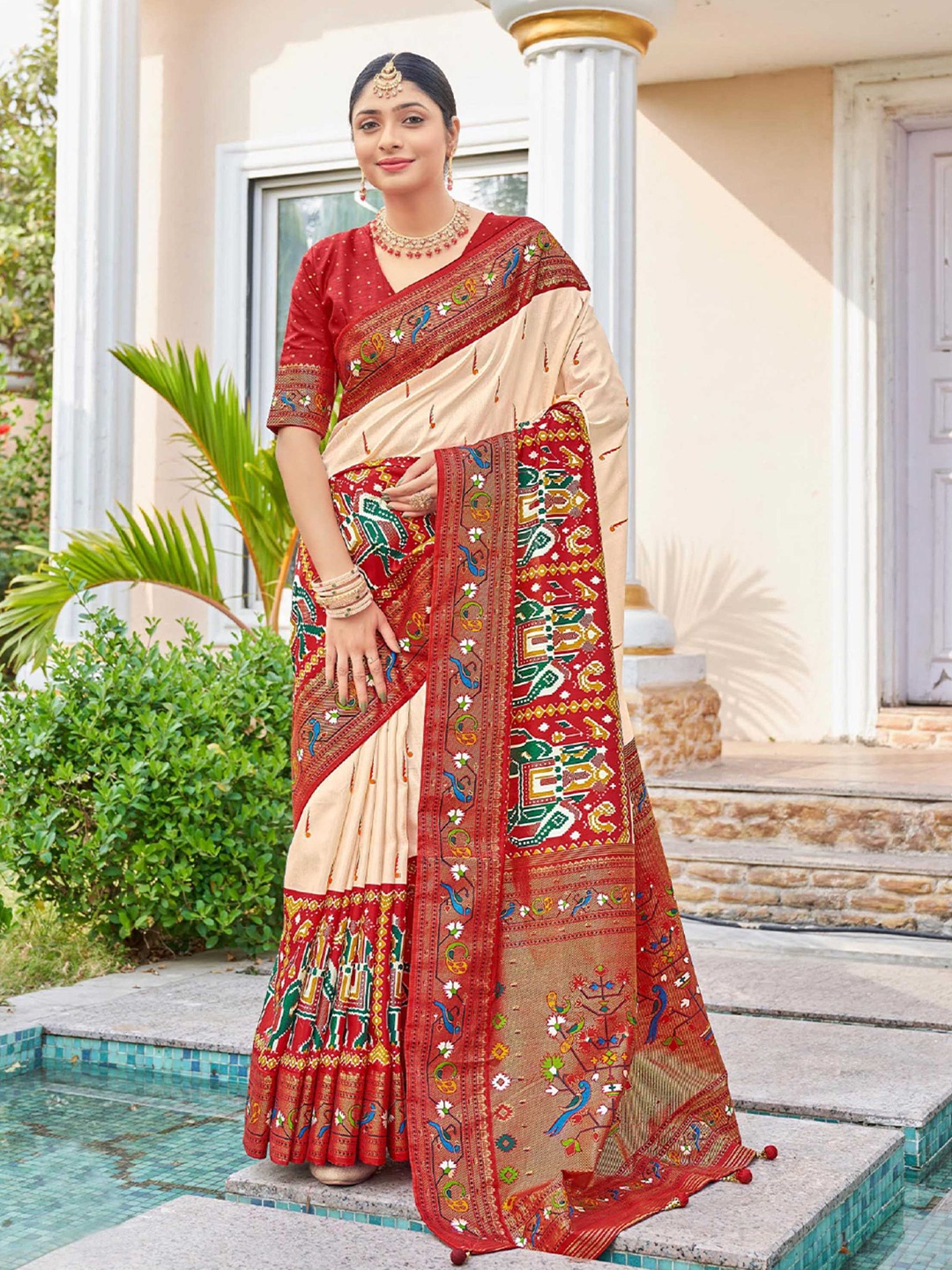 

Mitera Cream-Coloured & Red Ethnic Motifs Printed Zari Patola Saree