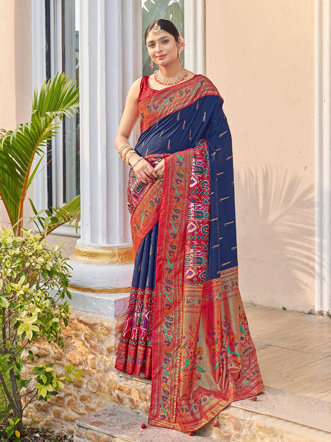 

Mitera Blue & Red Ethnic Motifs Printed Zari Patola Saree