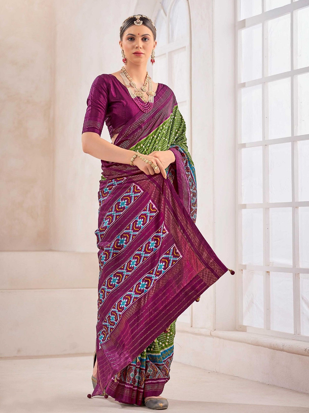 

Mitera Green Geometric Printed Zari Patola Saree