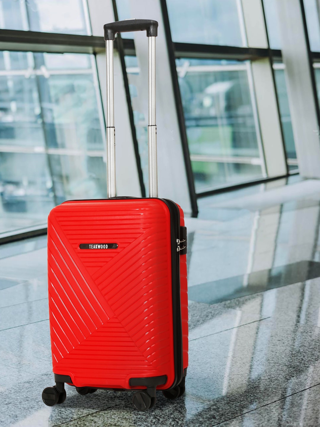 

Teakwood Leathers Textured Hard-Sided Cabin Trolley Suitcase, Red