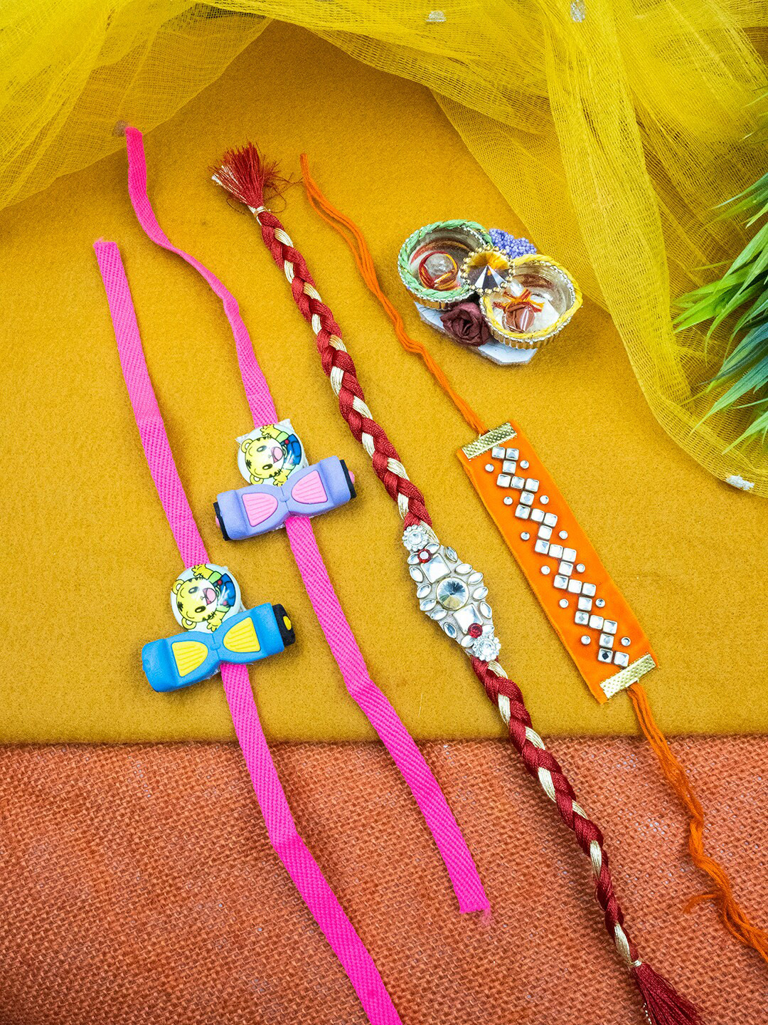

StileAdda Set Of 4 Rakhi with Card and Roli Chawal, Pink