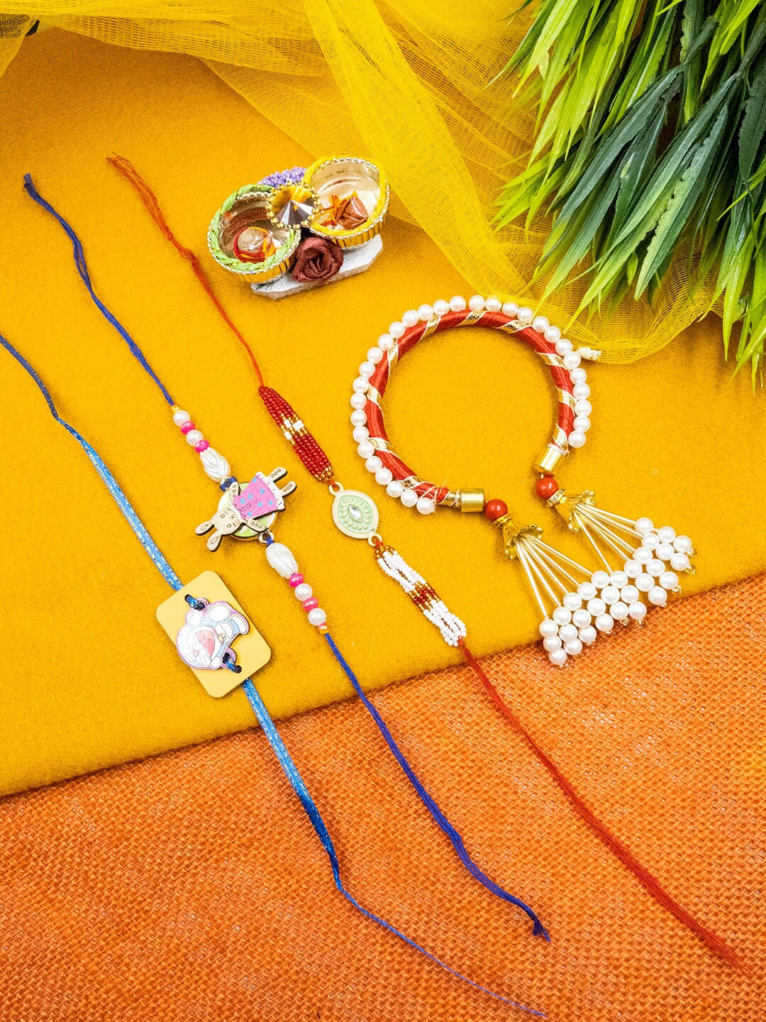 

StileAdda Set Of 4 Rakhi With Card And Roli Chawal, Blue