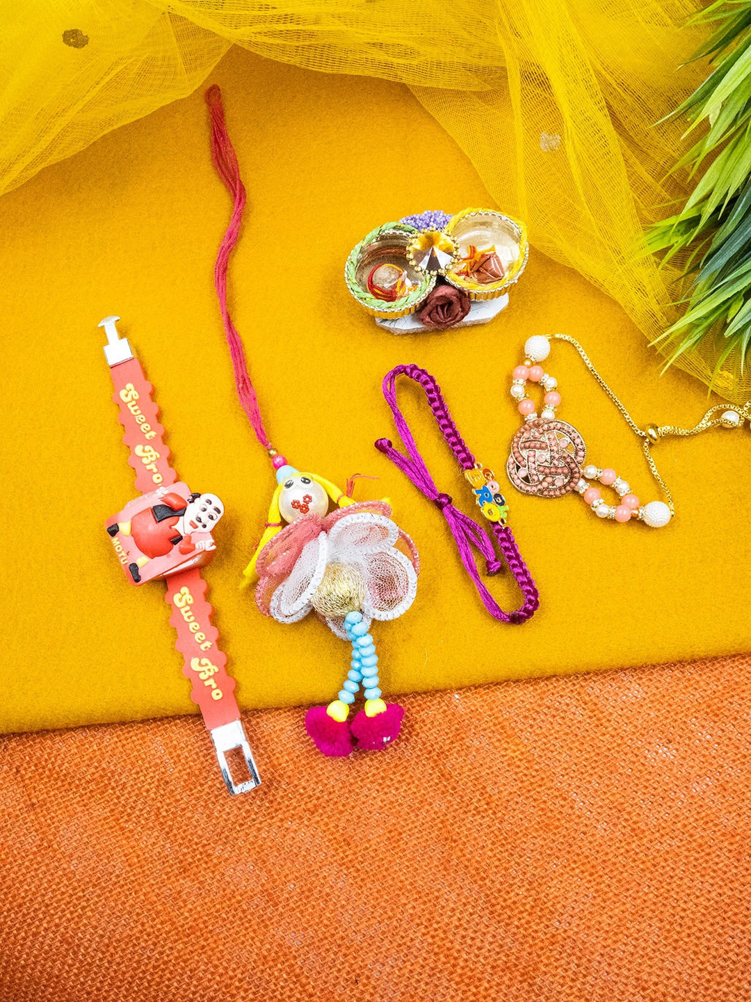 

StileAdda Set Of 4 Rakhi With Roli Chawal, Pink