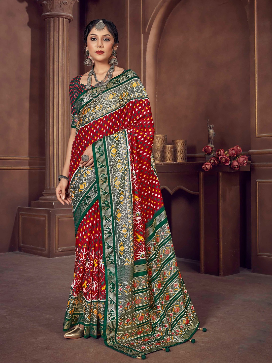 

Mitera Red & Green Ethnic Motifs Zari Patola Saree