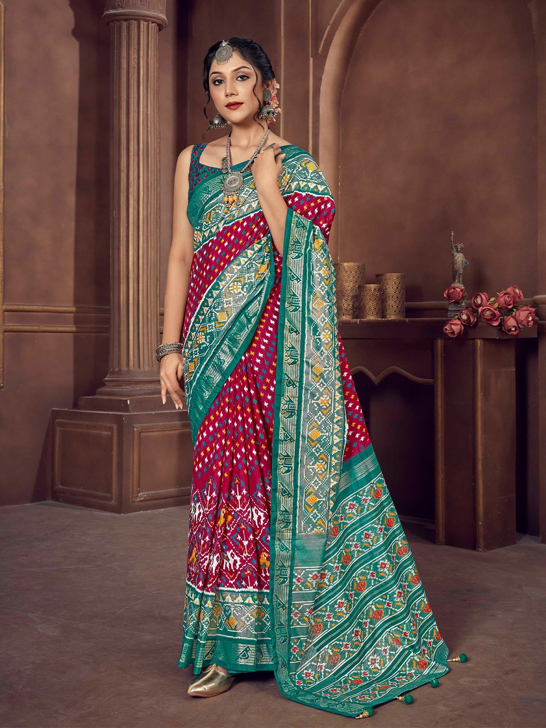 

Mitera Pink & Blue Ethnic Motifs Zari Patola Saree