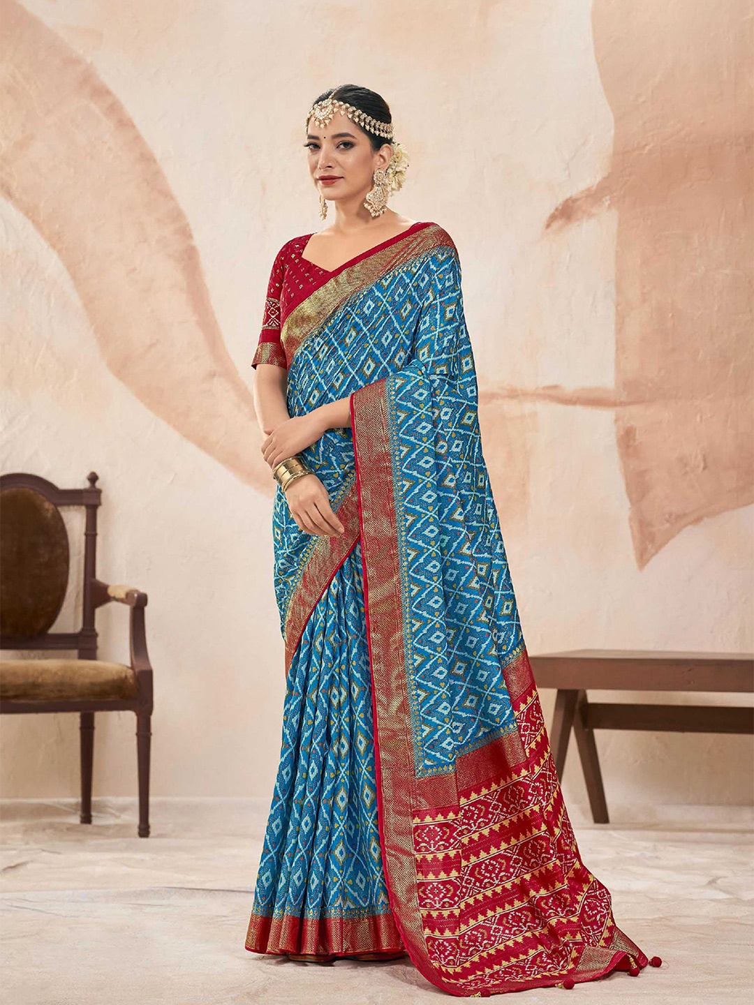 

Mitera Blue & Red Ethnic Motifs Printed Zari Patola Saree