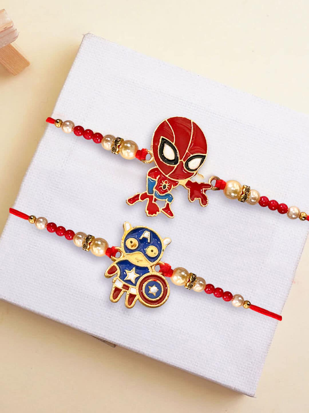 

TIED RIBBONS Kids Set of 2 Spiderman & Captain America Metal Rakhis With Greeting Card, Red